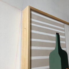 Bowl of Oranges With Green Bottle